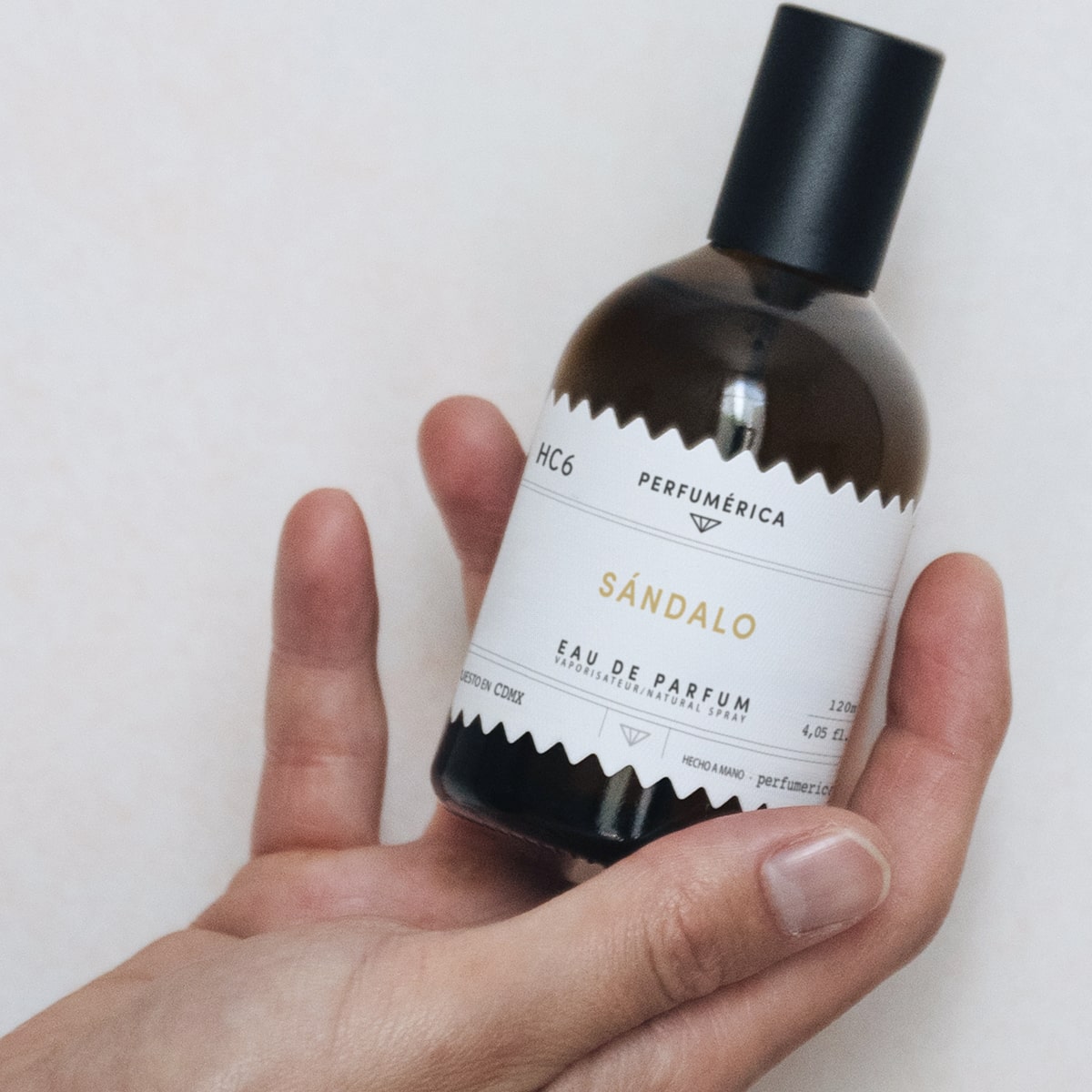 Perfumerica Sandalo Eau de Parfum (120 ml) - product shown being held. 