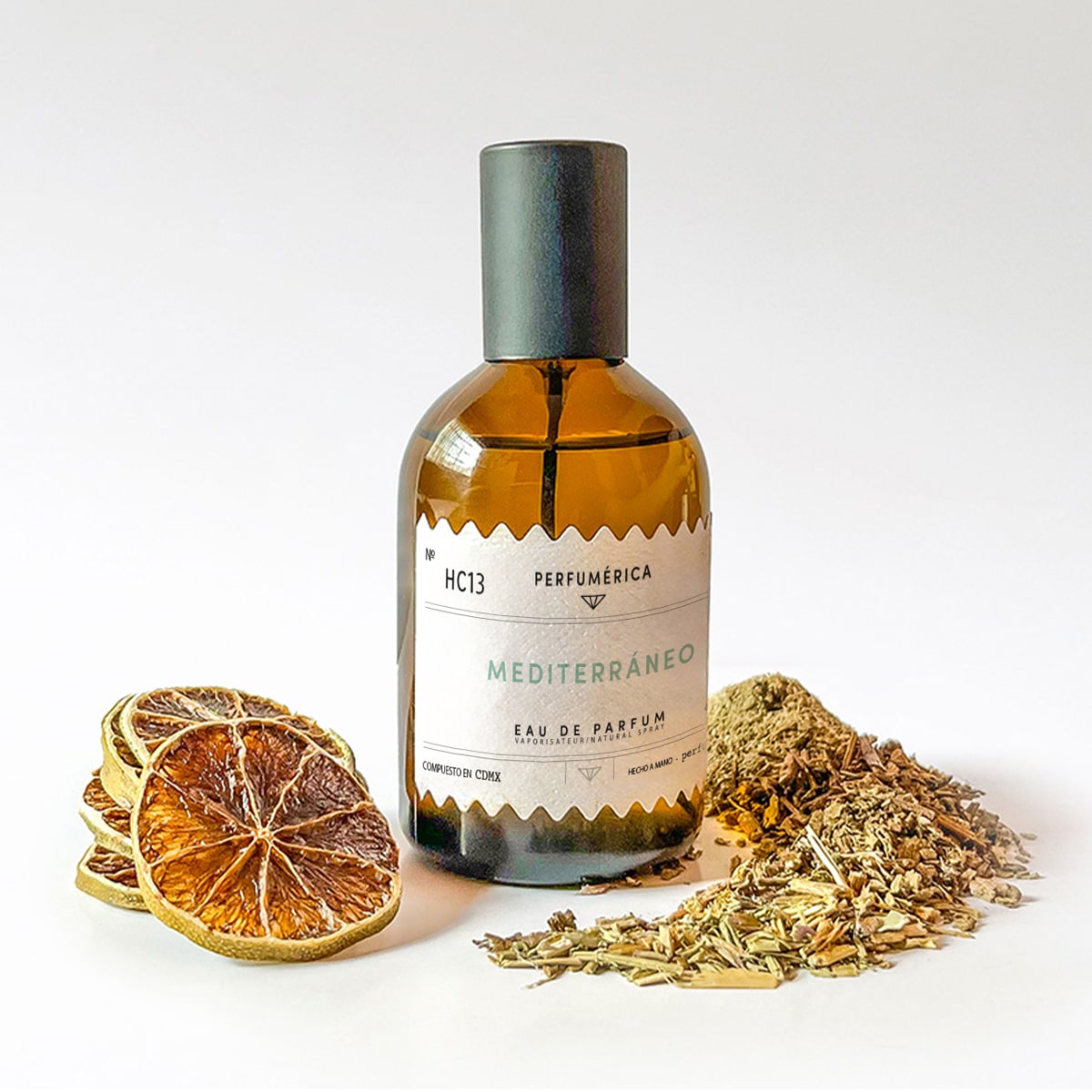 Perfumerica Mediterraneo Eau de Parfum (120 ml) - product shown with dried fruit and wood. 