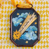 Maris Mirum Small Locket - Post Nubes Lux (1 pc) on a yellow and white patterned background