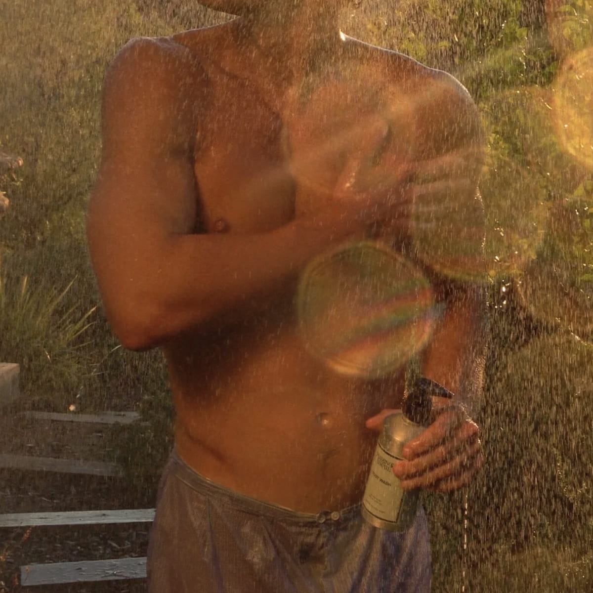 Flamingo Estate Organics Rosemary Clary Sage Body Wash (355 ml) - product shown being used by model.