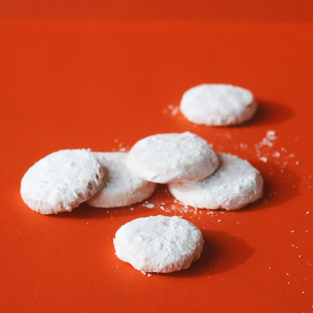 Romero Luna Mexican Wedding Cookies on a red background