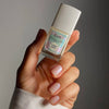 Kure Bazaar Vernis Lumière - Illuminateur White (10 ml) - product shown being held up by person. 