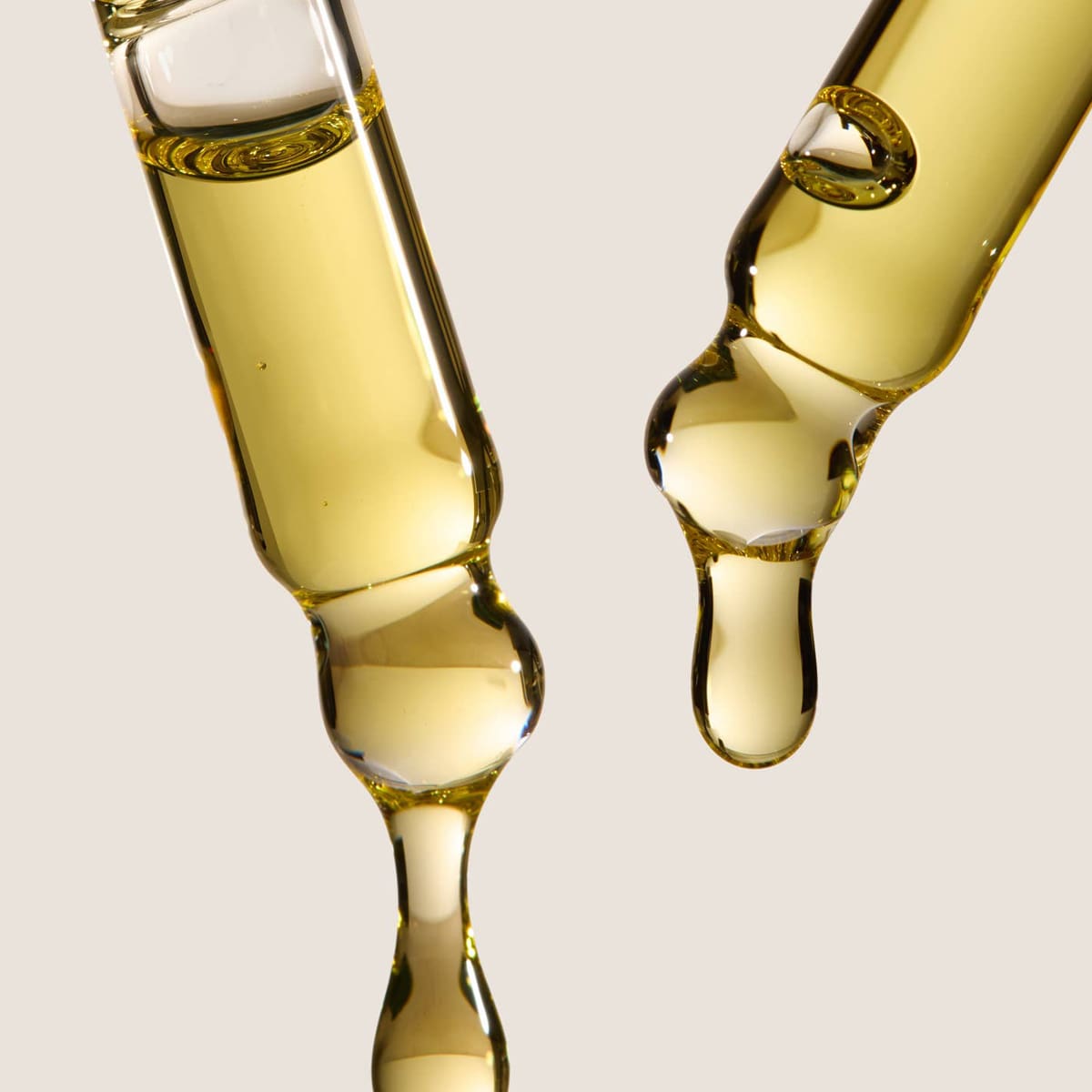 Close up of droppers showing Under Luna Hop-Infused Growth Serum