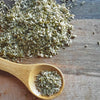 Pen & Cob Farm Spruce Salt (2 oz) - product shown in wooden spoon.