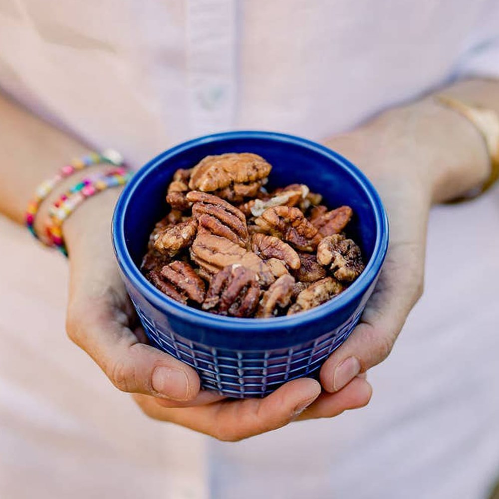 Zorro Pecans Maple Glazed Pecans (3.25 oz) - product shown in blue bowl. 