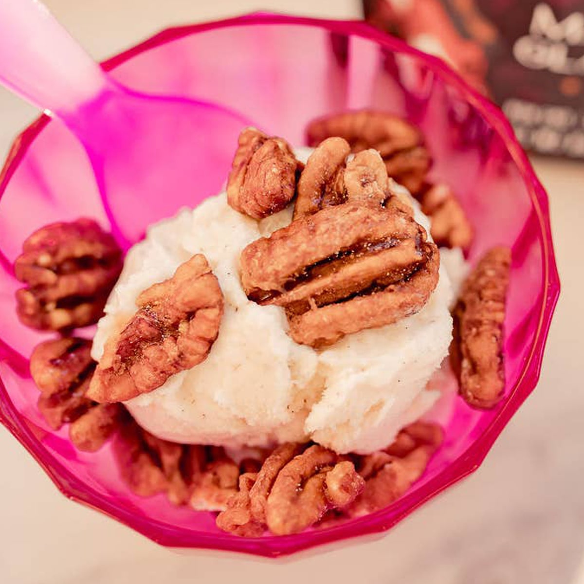Zorro Pecans Maple Glazed Pecans (3.25 oz) - product shown on top of ice cream in pink cup.