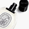 Diptyque Eau Rose Eau de Toilette (50 ml) - product shown on side with lid removed. 
