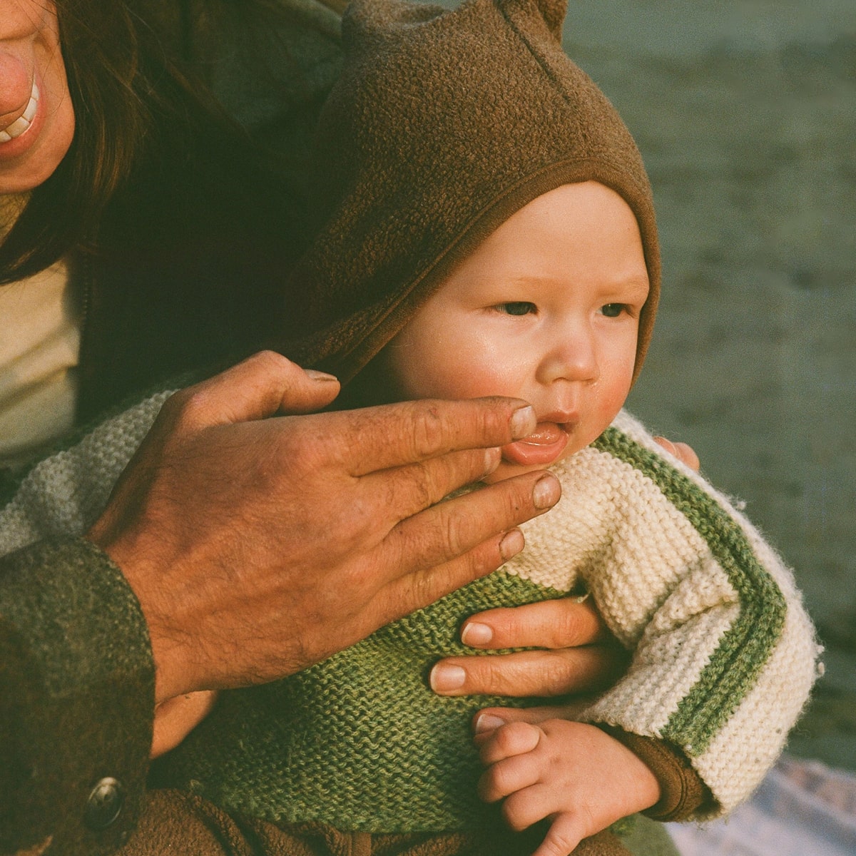 Dr. Max’s Baby Balm (3.3 oz) - product being applied to baby&#39;s face. 