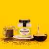 Pommery Dijon Mustard (100 g) - product shown on orange background with a bowl and mustard seeds.