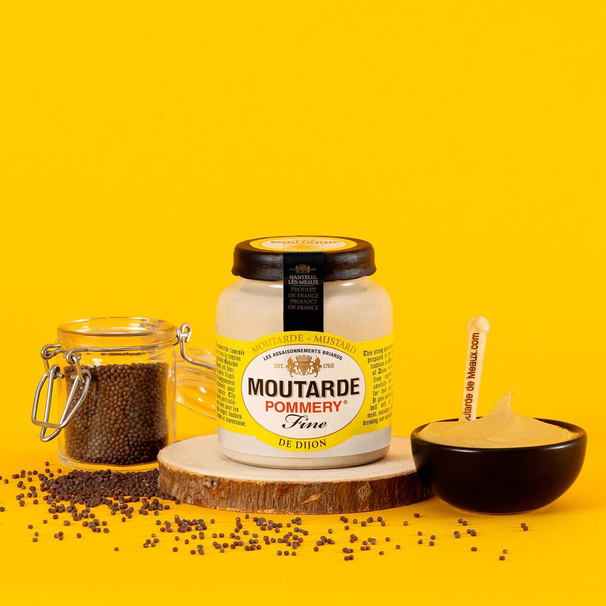 Pommery Dijon Mustard (100 g) - product shown on orange background with a bowl and mustard seeds.