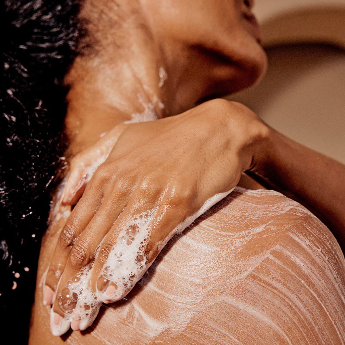 Innersense Organic Beauty Radiant Skin Ceremony Set (3 pcs) - product shown being lathered on model's back.