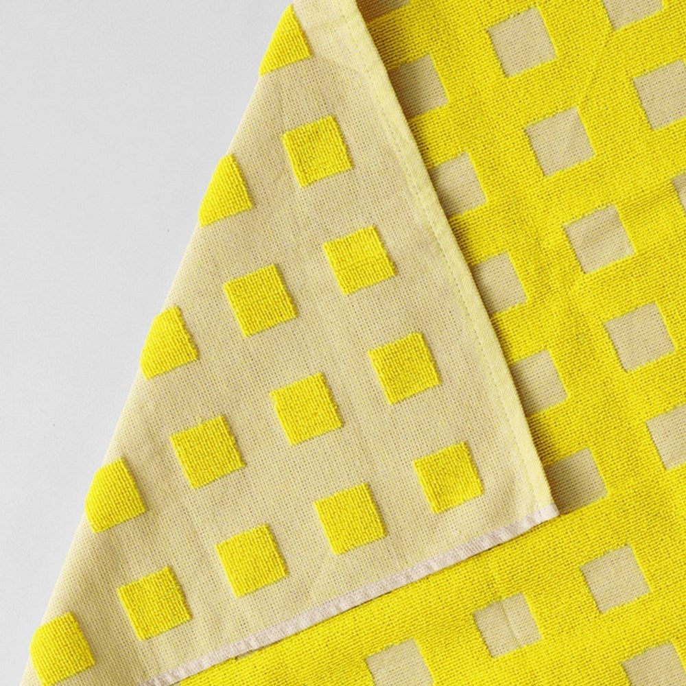 Close up of Wrap Squares Oat/Yellow Cotton Tea Towel (1 pc) showing front and part of back side