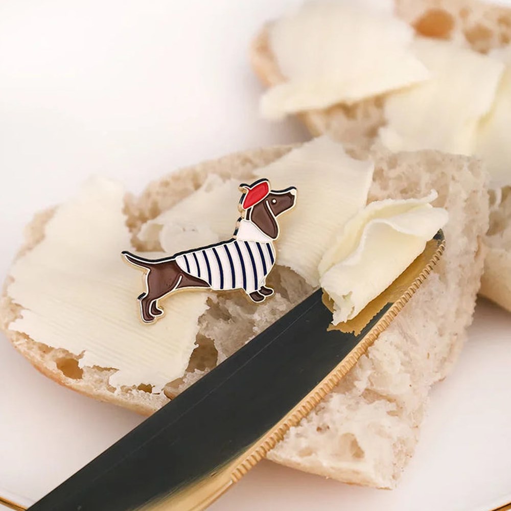 All The Ways To Say Little Frenchie Pin (1 pc) - product shown on bread with butter. 
