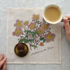 Fog Linen Work Hanky Isabelle B. No. 8 Anemone (1 pc) - product shown on table with coffee and cookies. 