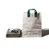 Puebco Vintage Sling Belt Bag - Green (1 pc) - product shown next to books. 
