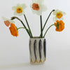 PetitFelts Porcelain Sardine Vase (1 pc) - product shown holding a few flowers. 