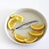 PetitFelts Porcelain Sardine Tray (1 pc) - product shown holding sliced oranges. 