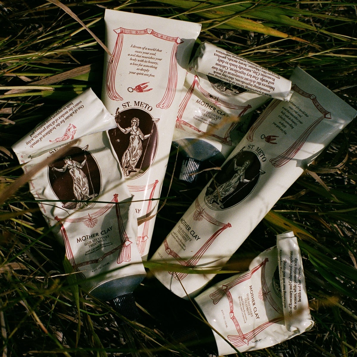 St. Meto Mother Clay Hair Recovery Treatment (4 oz)  - product shown in grass.