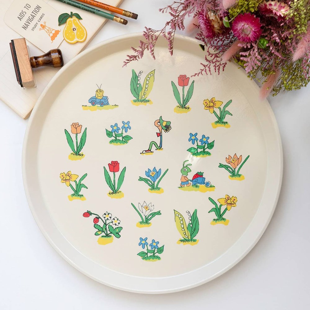 Lifestyle shot of Three Potato Four 3P4 X Richard Scarry Large Round Tray - Floral (1 pc) with flowers and pencils in the background
