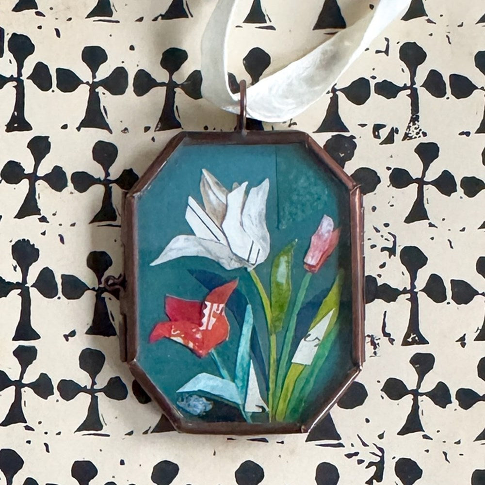 Maris Mirum Small Locket - Tulip Trio (1 pc) shown on patterned black and white paper