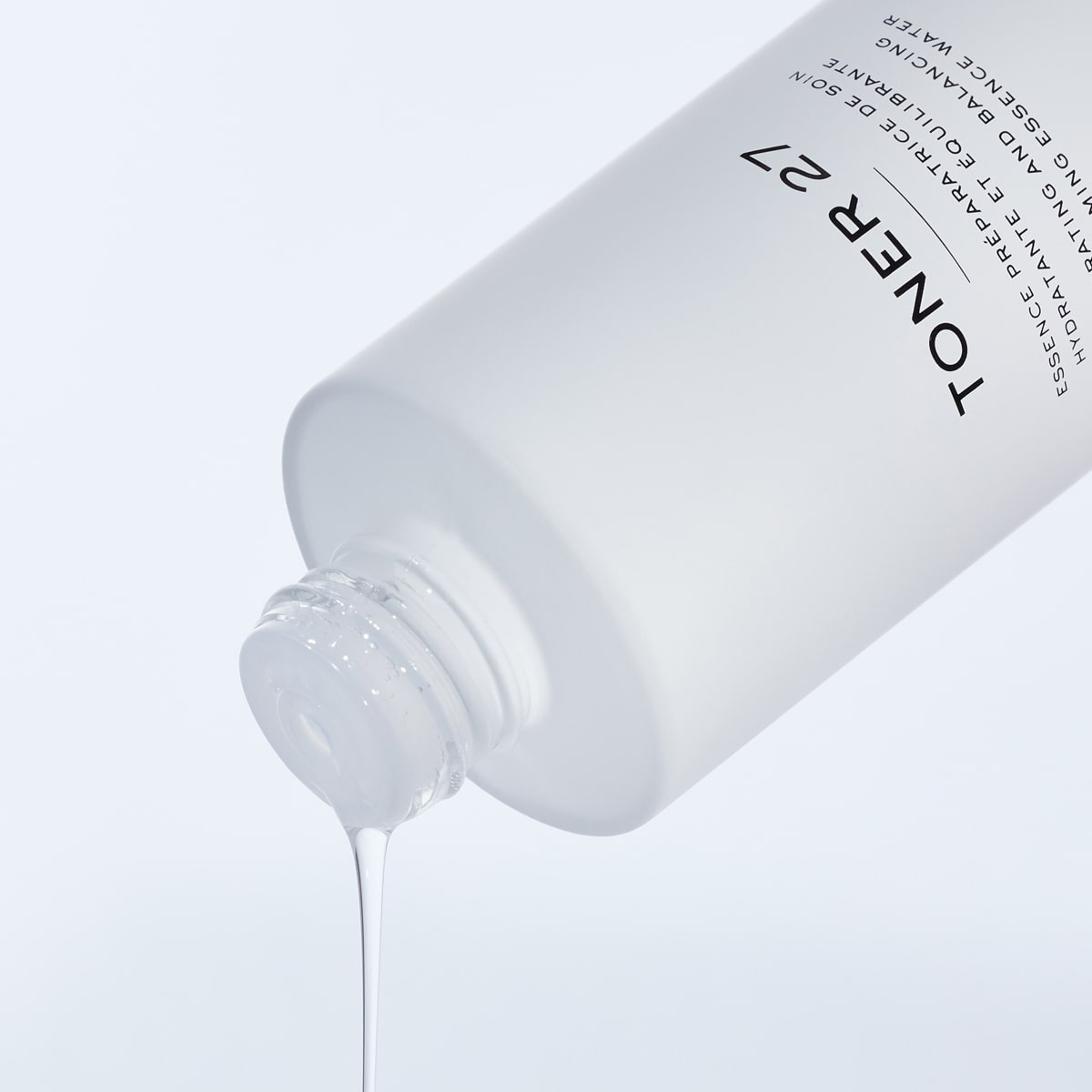 Close up of Cosmetics 27 Toner 27 Hydrating and Balancing Skin-Priming Essence Water (100 ml) being poured