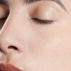 Close-up of a person's face with a focus on the skin texture from using Cosmetics 27 Toner 27 Hydrating and Balancing Skin-Priming Essence Water