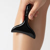 LAKA Body Sculpter (1 pc) - product shown being used by model on leg. 