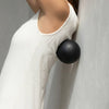 LAKA Tissue Release Ball (1 pc) - product being used under woman's back. 