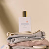 Minois Paris Eau de Senteur (Scented Water) (50 ml) - product shown on top of laundry.