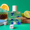 Maison Matine Hasard Bazar Eau de Parfum (50 ml) - product shown on green background with a dice and a cocktail. 