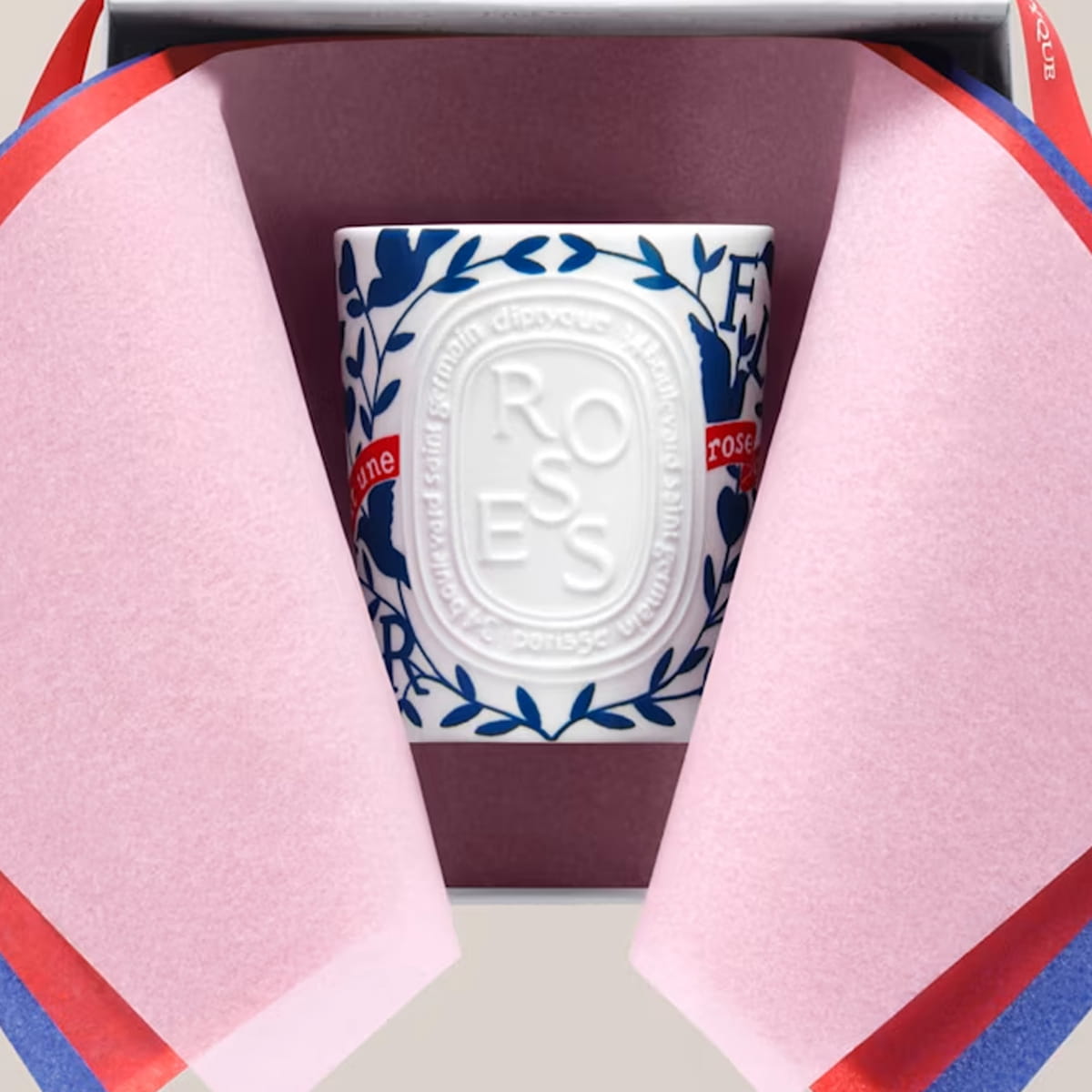 Diptyque Limited Edition Roses Candle (600 g) inside a gift box with tissue paper.