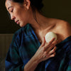 Kate McLeod Breathe Stone Deep Moisturizing Lotion Bar (3.5 oz) - product shown being used by woman. 