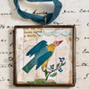 Maris Mirum Large Locket - Cassis Folk Bird (1 pc) - product shown on white paper with font. 