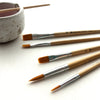 Breathe People Paintbrush Set (5 pcs) - product shown on counter with a ceramic dish (ceramic dish not included).