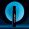 Heretic Parfum Nocturnal Tuberose Eau de Parfum (15 ml) - product shown in front of circular blue light. 