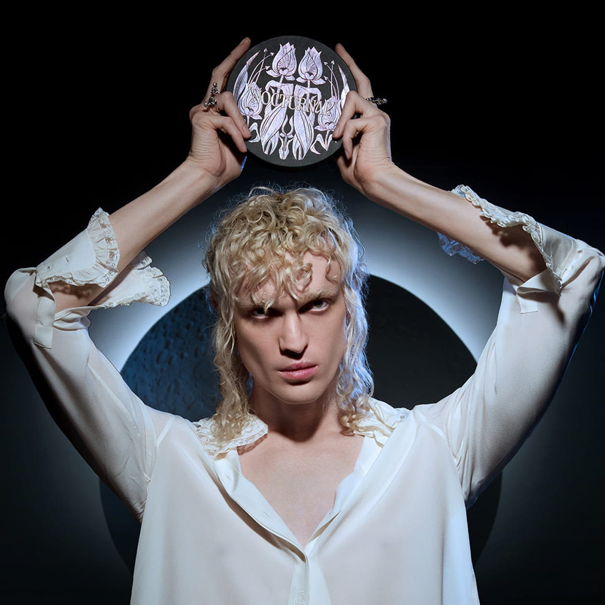 Heretic Parfum Nocturnal Discovery Set (3 pcs) - product shown being held by model in white blouse above models head.