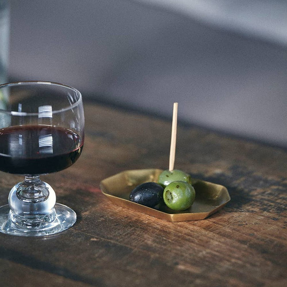 Fog Linen Work Brass Long Octagonal Plate - Small (1 pc) - product shown with olives on top.