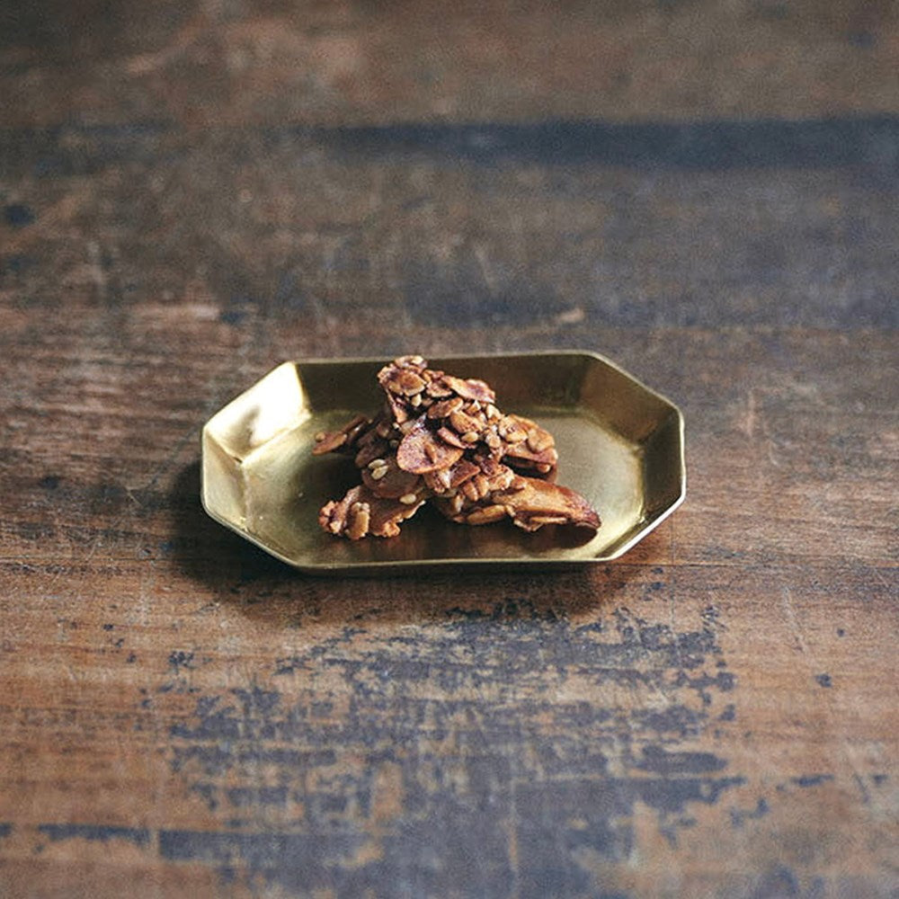Fog Linen Work Brass Long Octagonal Plate - Small (1 pc) - product shown with granola on top.