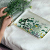 Fog Linen Work Isabelle Boinot Medium Linen Tray - Fleur Sauvage (1 pc) - product shown on white table cloth with flowers next to it. 