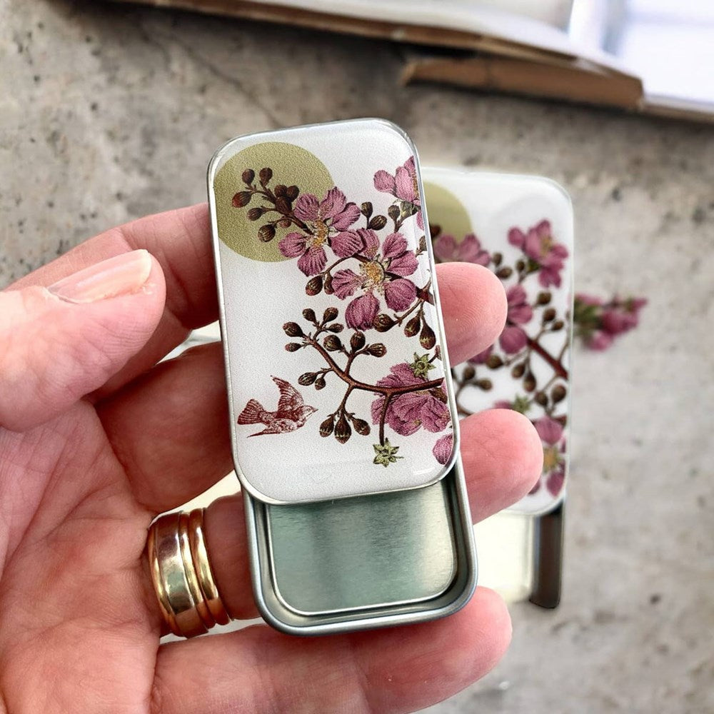 Firefly Notes Cherry Blossom & Swallow Tin - Small (1 pc) - product shown being held while open.