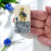 Firefly Notes Duck and Flower Tin - Small (1 pc) - product shown being held by person on white background with blue flowers.
