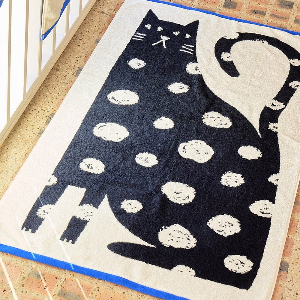 Donna Wilson Limited Lazy Cat Bath Towel (1 pc) shown on floor