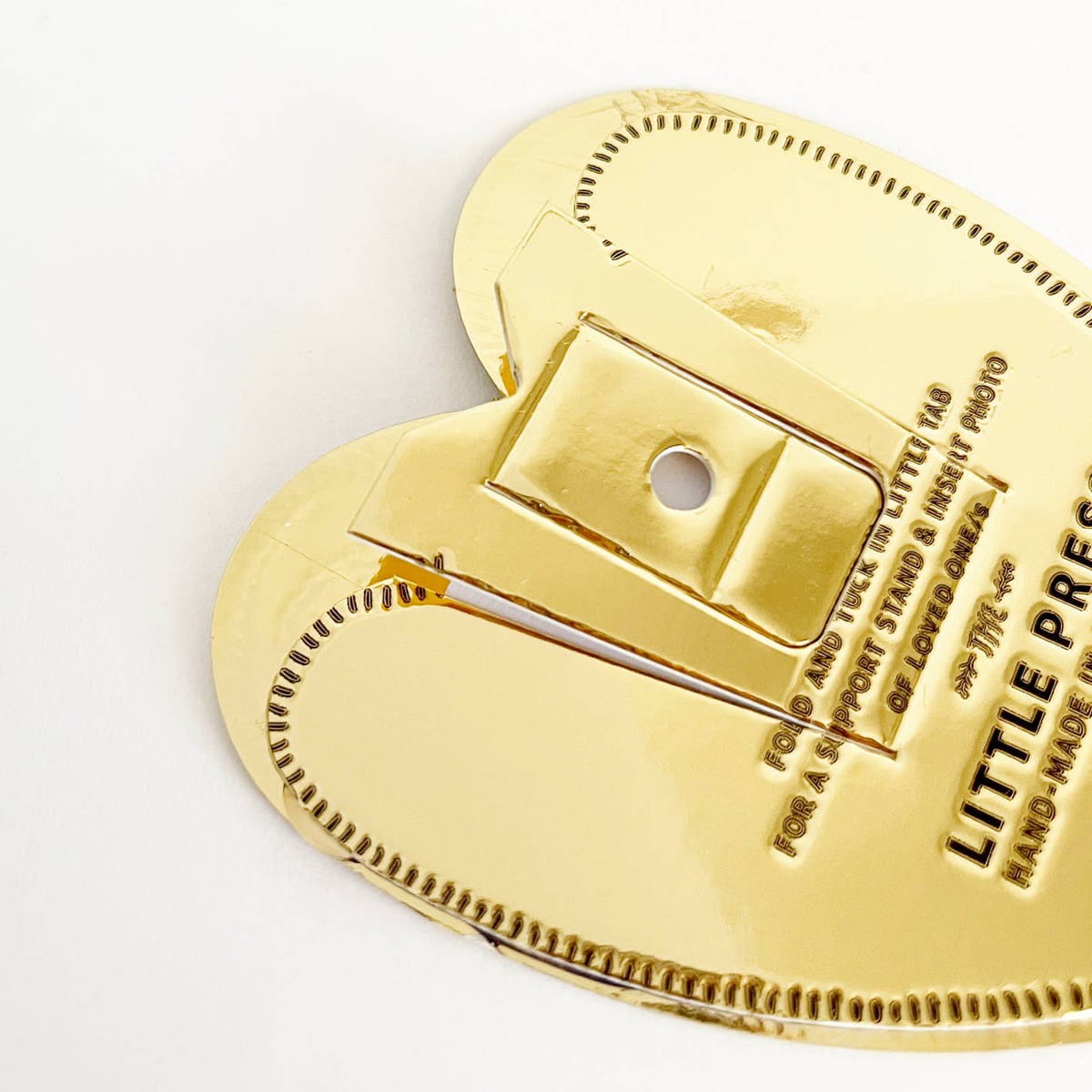 The Little Press Faux Tin Heart Frame - Gold (1 pc) - back of product shown close-up.