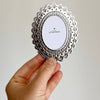 The Little Press Faux Tin Oval Frame - Silver (1 pc) - product shown being held.