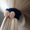 byEloise Bling Bow Bubble Charm Hairband – Navy Blue (1 pc) - product shown in hair.