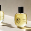 Diptyque Satin Oil (100 ml) - product shown on white countertop. 