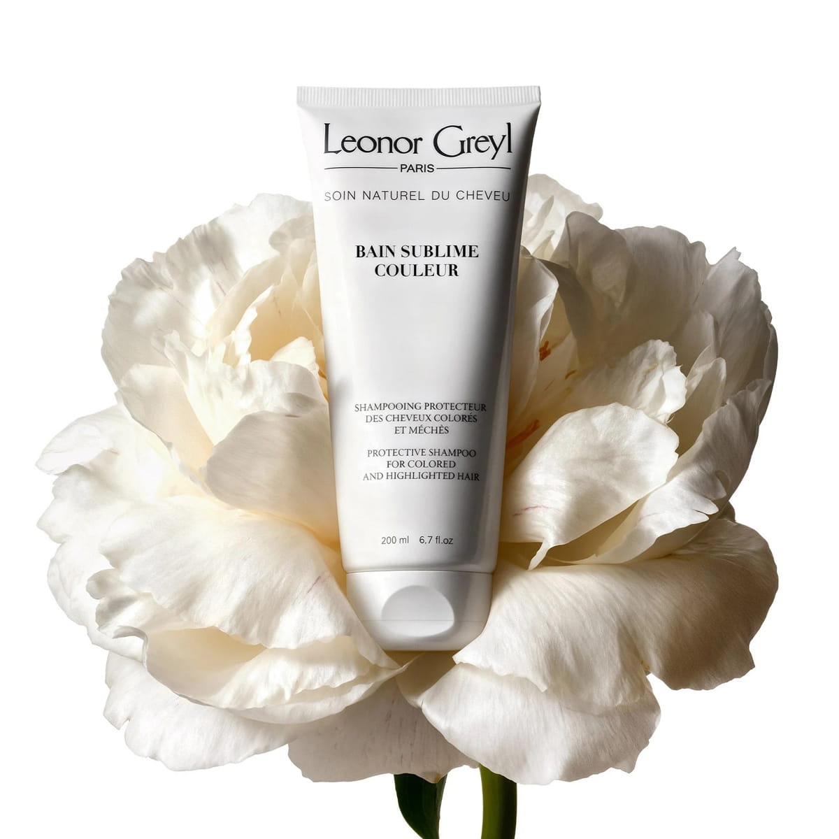Leonor Greyl Bain Sublime Couleur (200 ml) - product shown inside of blooming white flower.
