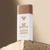 Yon-Ka Paris 50+ Mineral Fluid Broad Spectrum Sunscreen (60 ml) - product shown on cement. 