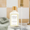 Rahua Voluminous Conditioner (275 ml) - product shown on sink. 