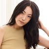 Rahua Voluminous Conditioner (275 ml) - product shown on model's hair. 
